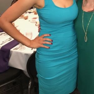 Teal colored, flattering ruched dress!